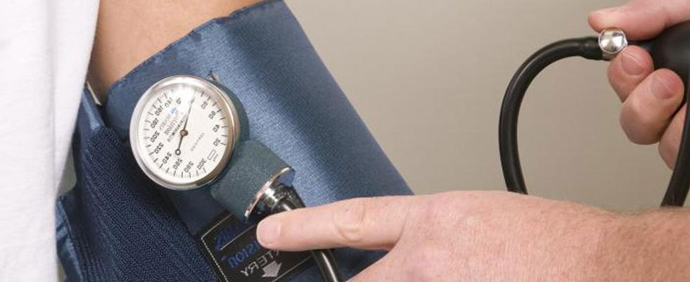 image of hand and blood pressure cuff